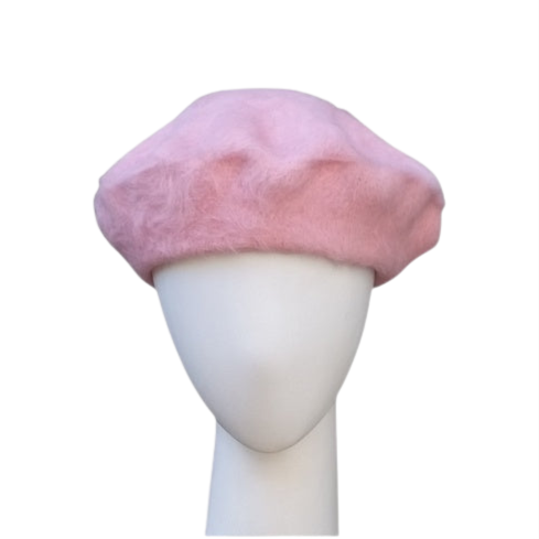 A pink beret made of angora and wool, displayed on a mannequin head.