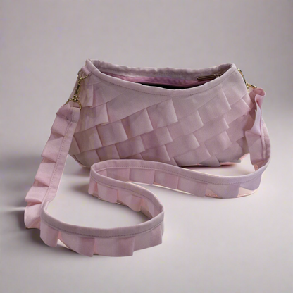 Pink axel mano clutch bag with detachable strap