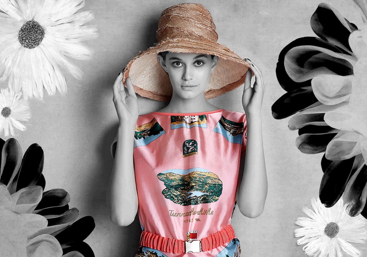 Woman wearing a pink sleeveless dress with pink Axel Mano Belt and Axel Mano wide brim straw hat