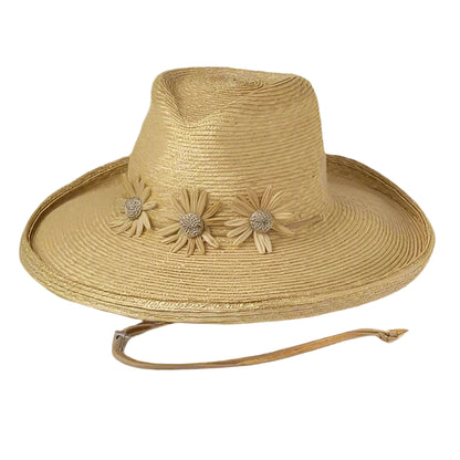 A straw hat with cord ties and daisy details on the brim.